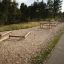 Utendørs treningspark Balansebom ved siden av en gangsti.